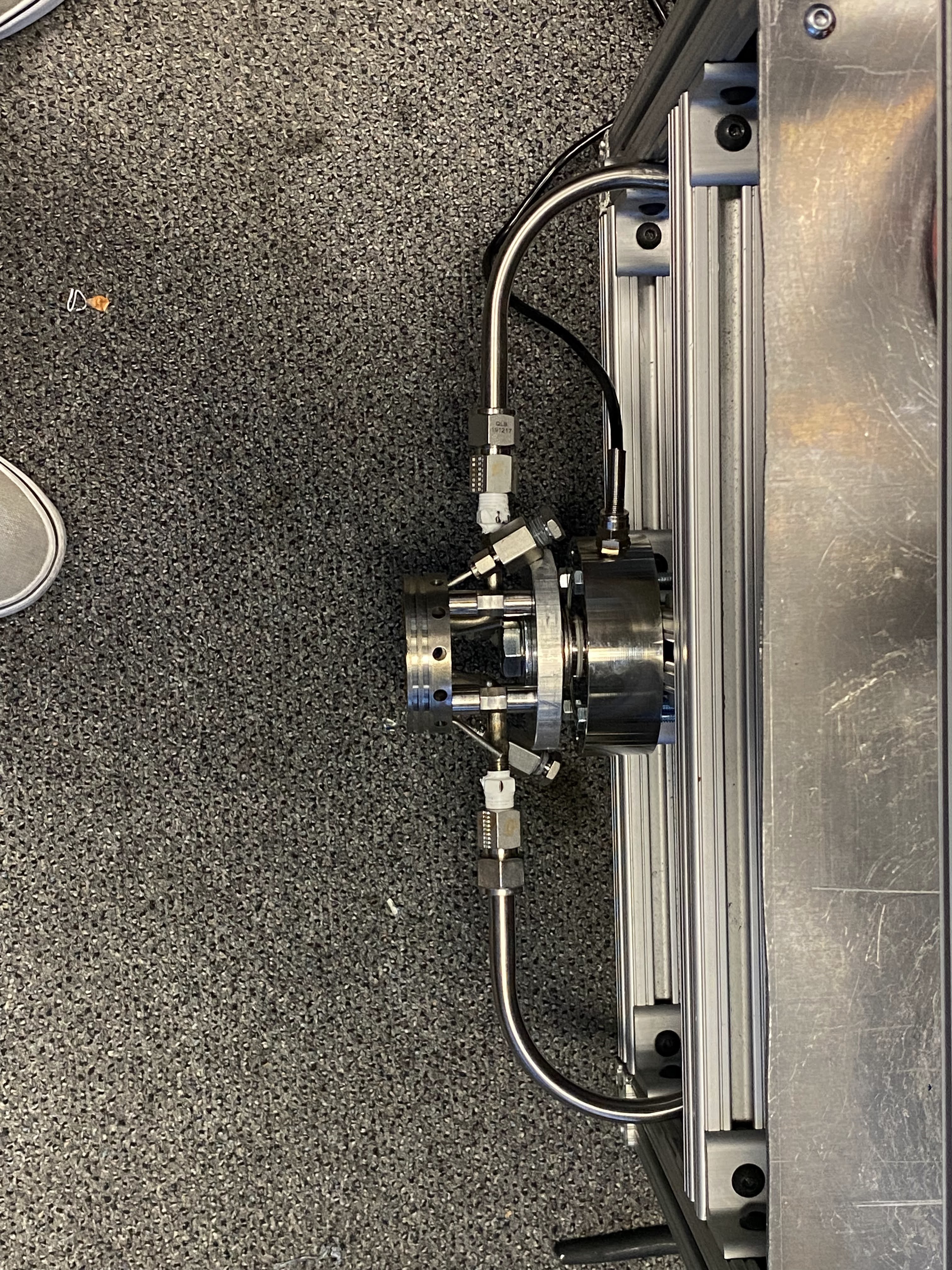 Top-down view showing plumbing routing to injector